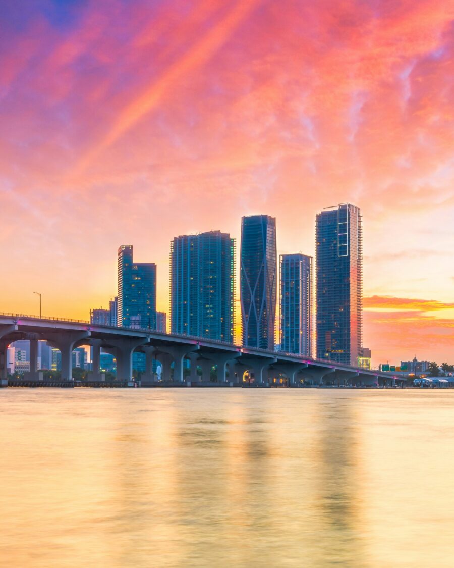 A scenic view of a bridge extending over a large body of water.