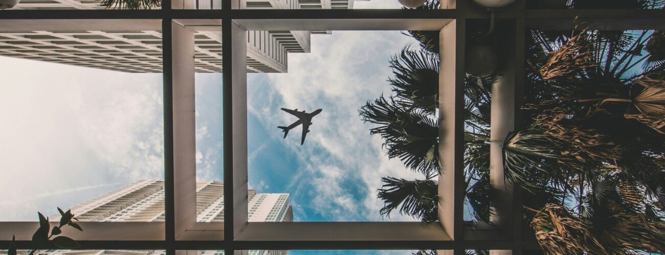Low angle view of modern high-rise architecture under a clear sky in downtown Miami.